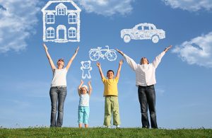 Family raising hands to the sky with clouds shaped like a house teddy bear bike and car
