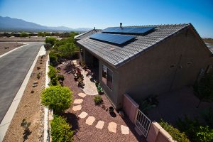 Desert House with solar panels on tile roof